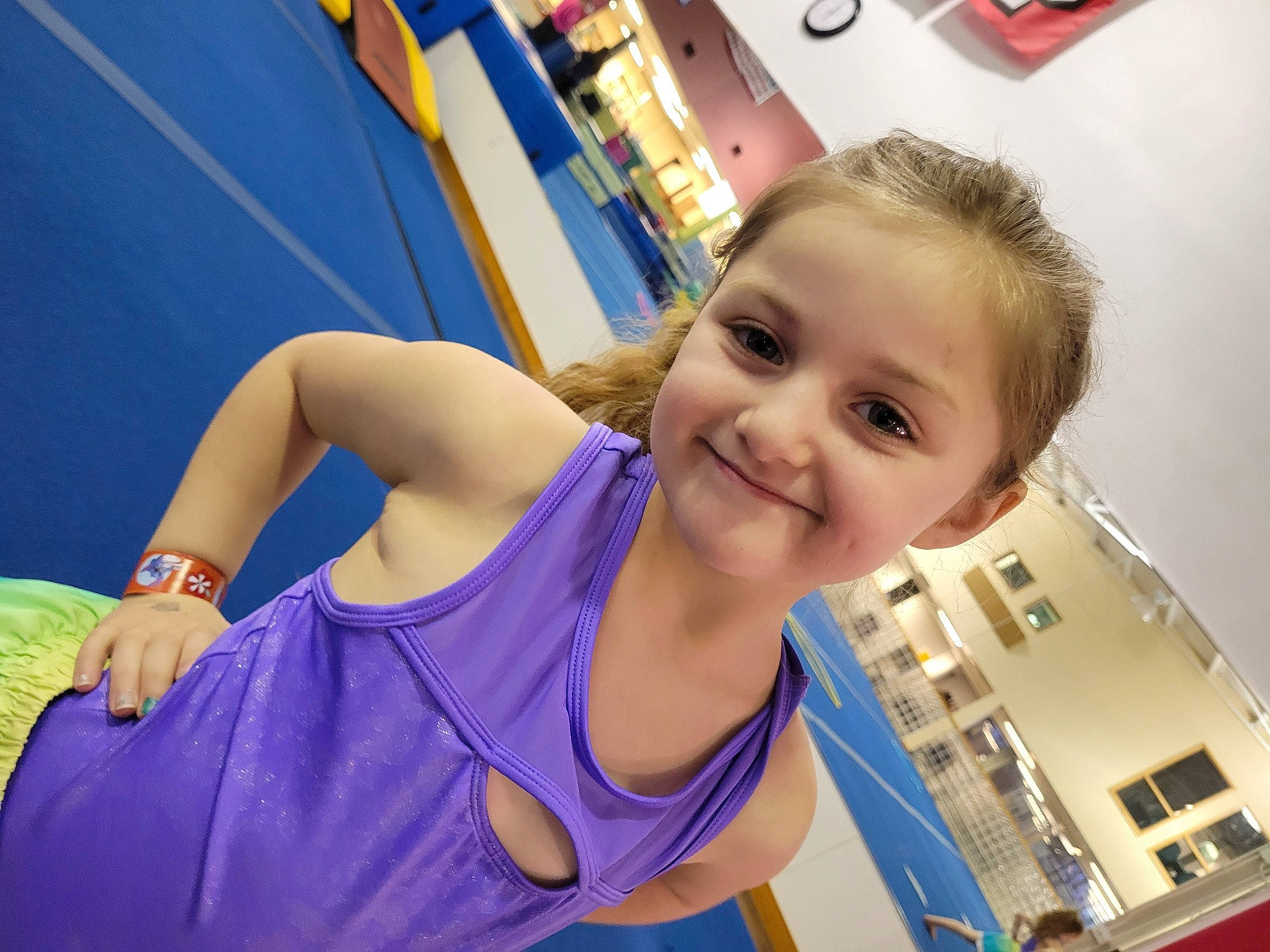 Lexi is registered to the contest to win money with this photo: abdomen, blond, blue, chest, child, elbow, electric_blue, finger, fun, hairstyle, happy, joint, joy, leisure, neck, person, shoulder, smile, t_shirt, thigh