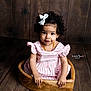 Karma joined the competition — help win amazing prizes! child, toddler, girl, curly_hair, white_bow, pink_striped_dress, amber_necklace, wooden_bowl, wooden_floor, wood_panel_wall, studio_portrait, portrait, sitting, smile, big_eyes, hands, cute, prop, watermark, photography