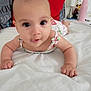 Sophia joined the competition — help win amazing prizes! baby, infant, bed, pillow, white_bedspread, indoor, person, child, cute, smiling, face, arms, furniture, home, bedding, pink_bottle, lamp, decor, sleepwear, curious