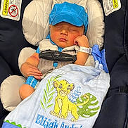 Elijah joined the competition — help win amazing prizes! baby, blanket, blue_cap, car_seat, child, closeup, clothing, comfort, cute, embroidery, infant, lion_king, newborn, peaceful, portrait, resting, seatbelt, simba, sleeping, soft