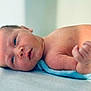 Elijah is registered to the contest to win money with this photo: baby, blue_blanket, child, close_up, cute, face, fresh, hand, human, indoors, infant, lying_down, newborn, peaceful, portrait, resting, skin, small, soft_light, toddler