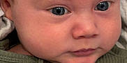 Elijah joined the competition — help win amazing prizes! baby, blue_eyes, buttons, child, close_up, clothing, curious, cute, expression, face, green_shirt, head, human, indoors, infant, newborn, portrait, skin, soft_light, young_child