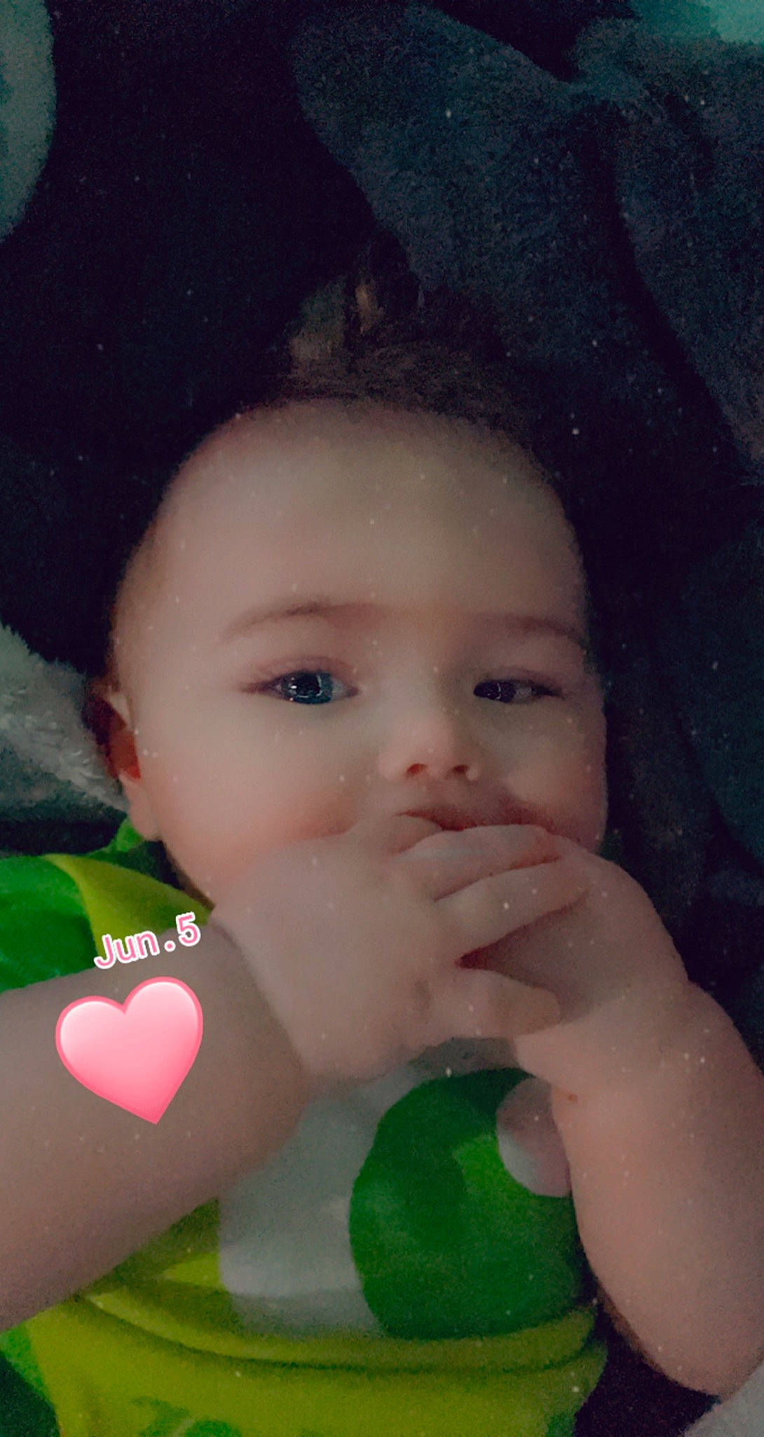 Malikai is registered to the contest to win money with this photo: black_hair, cheek, chin, eye, eyebrow, eyelash, face, facial_expression, forehead, gesture, hair, happy, head, iris, lip, nose, person, pink, skin, toddler