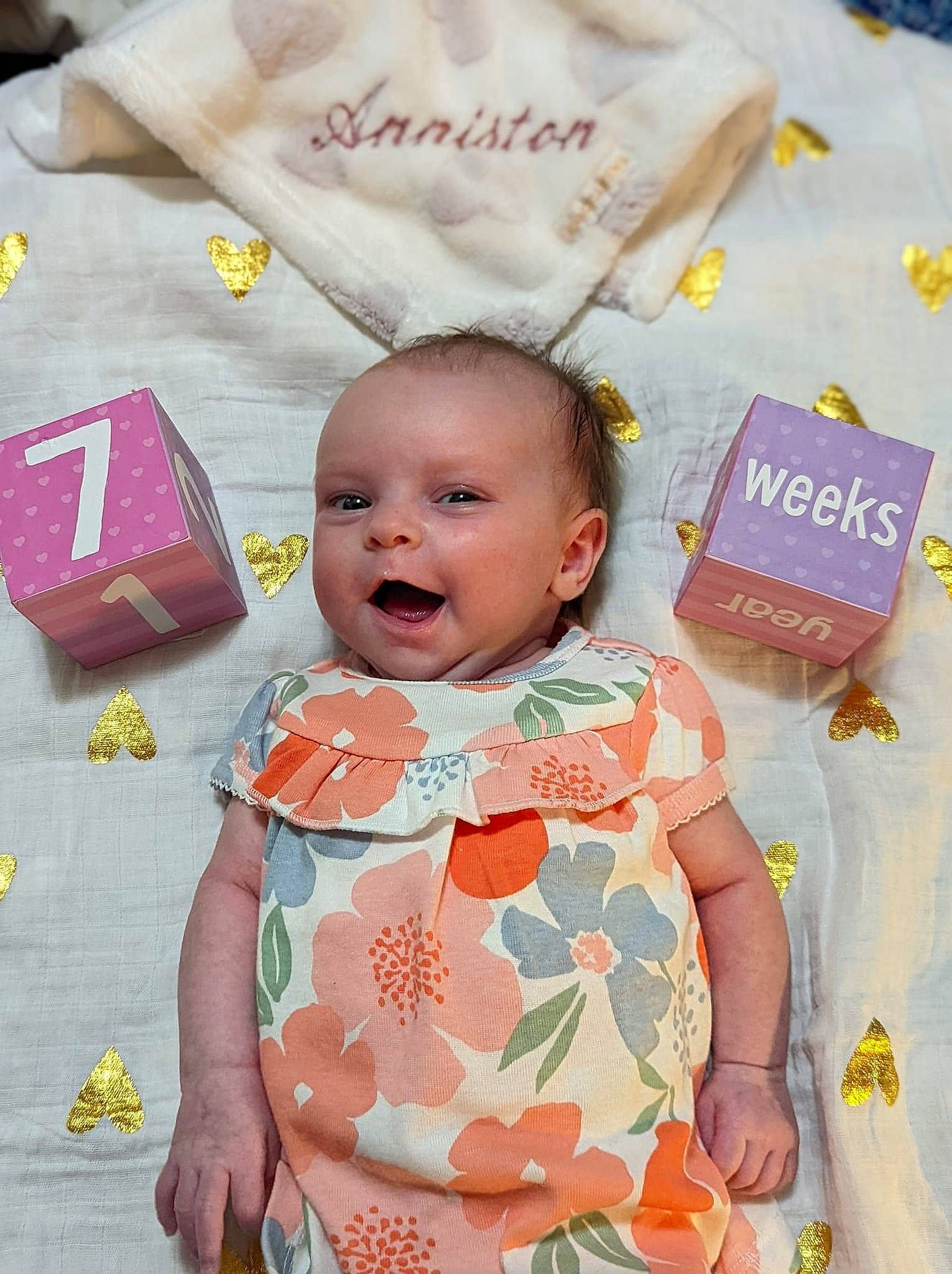 Anniston joined the competition — help win amazing prizes! baby, baby_toddler_clothing, beauty, cheek, child, dress, event, facial_expression, happy, linens, pattern, peach, person, pink, product, skin, sleeve, smile, textile, toddler