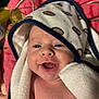 baby, smiling, towel, face, infant, closeup, happy, child, blanket, skin, head, person, cute, indoors, comfort, expression, newborn, wrapped, portrait, warm