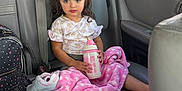 Mía Blanca is registered to the contest to win money with this photo: blue_sky, car_interior, car_seat, car_window, child, clouds, cozy, curly_hair, floral_dress, passenger, pink_blanket, pink_sunglasses, polka_dot_backpack, portrait, road_trip, seat_belt, sippy_cup, socks, toddler, white_sneaker