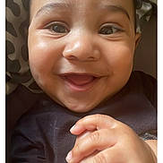Messiah joined the competition — help win amazing prizes! baby, smiling, hands, face, portrait, infant, happy, closeup, child, black_shirt, patterned_blanket, cute, skin, eyes, fingers, indoors, person, young_child, expression, joy