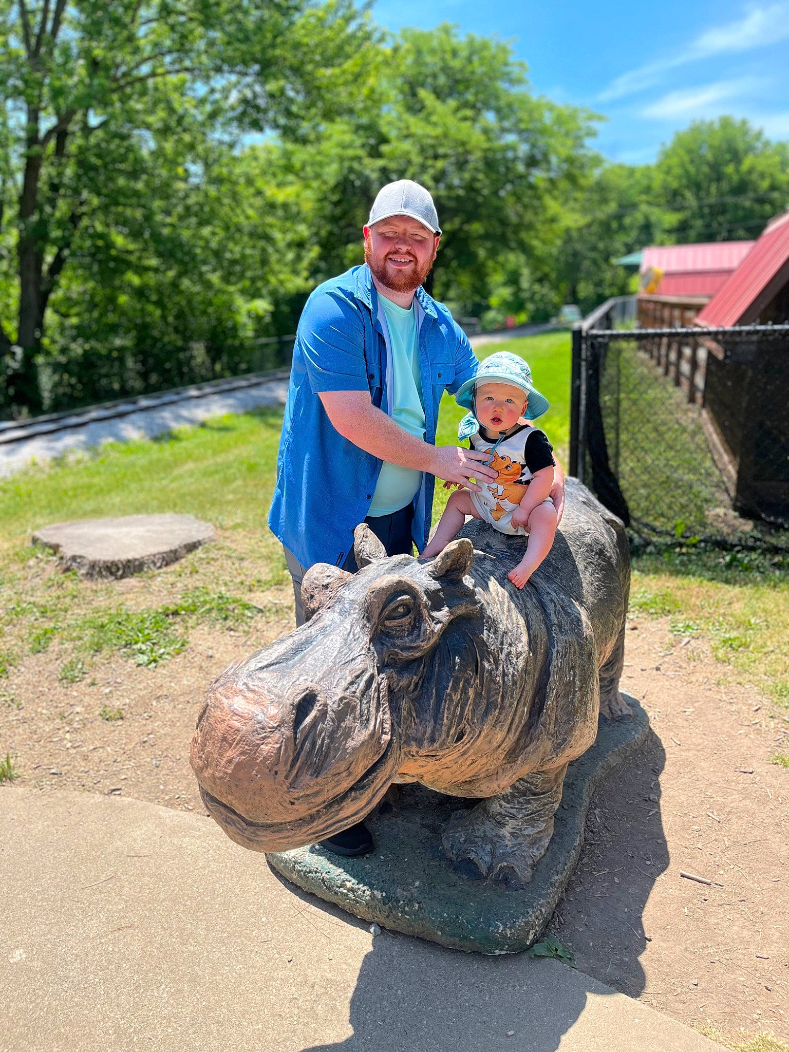 Kal joined the competition — help win amazing prizes! art, crocodile, grass, hat, headwear, joy, landscape, leisure, person, plant, recreation, reptile, sculpture, shorts, sky, smile, statue, t_shirt, terrestrial_animal, tree