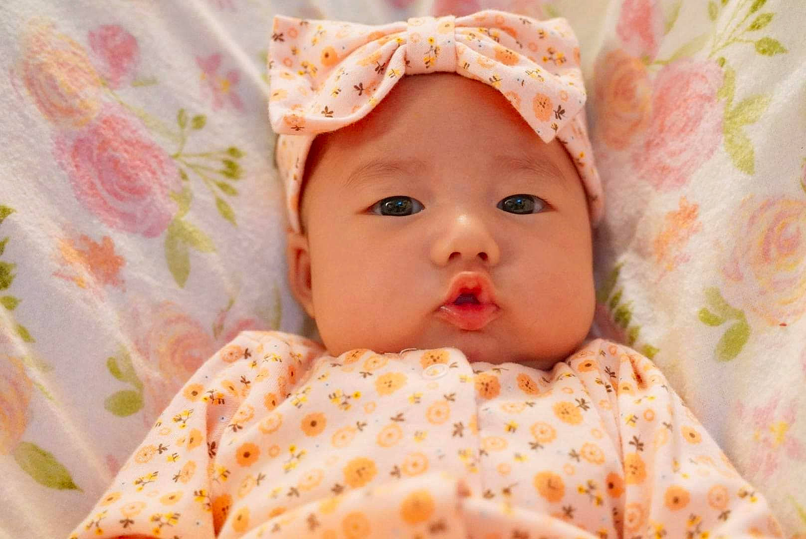 Irene is registered to the contest to win money with this photo: baby, baby_toddler_clothing, cheek, child, comfort, eye, face, happy, hat, headwear, iris, linens, lip, nose, pattern, peach, person, pink, skin, sleeve