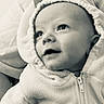 baby, child, infant, portrait, close_up, face, hood, hooded_jacket, fleece, clothing, sitting, indoors, soft_lighting, black_and_white, monochrome, looking_up, wide_eyed, open_mouth, cozy, photography