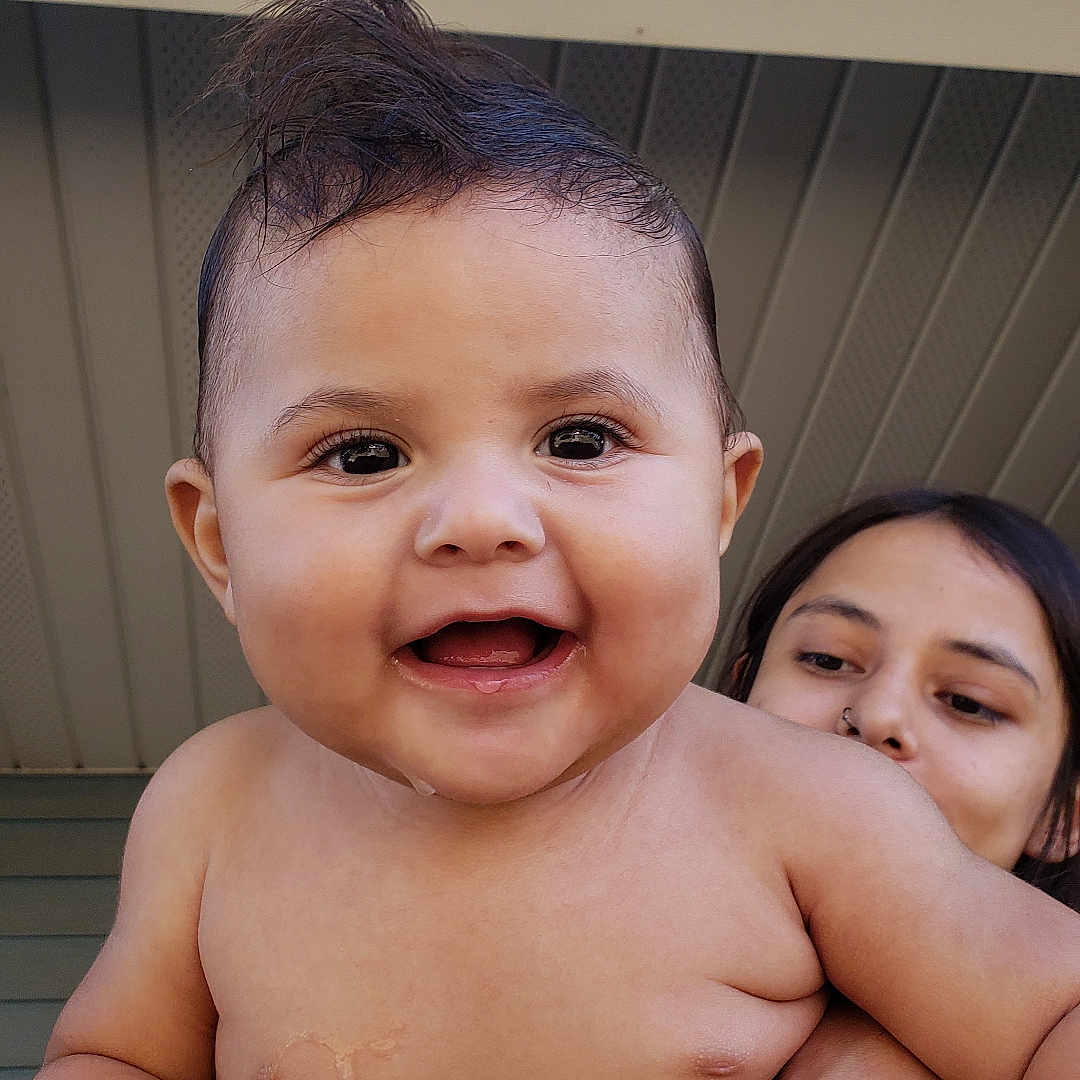Jody joined the competition — help win amazing prizes! adult, arm, baby, background, bracelet, casual, child, closeup, expression, face, hair, hand, happy, holding, outdoor, people, person, portrait, skin, smiling