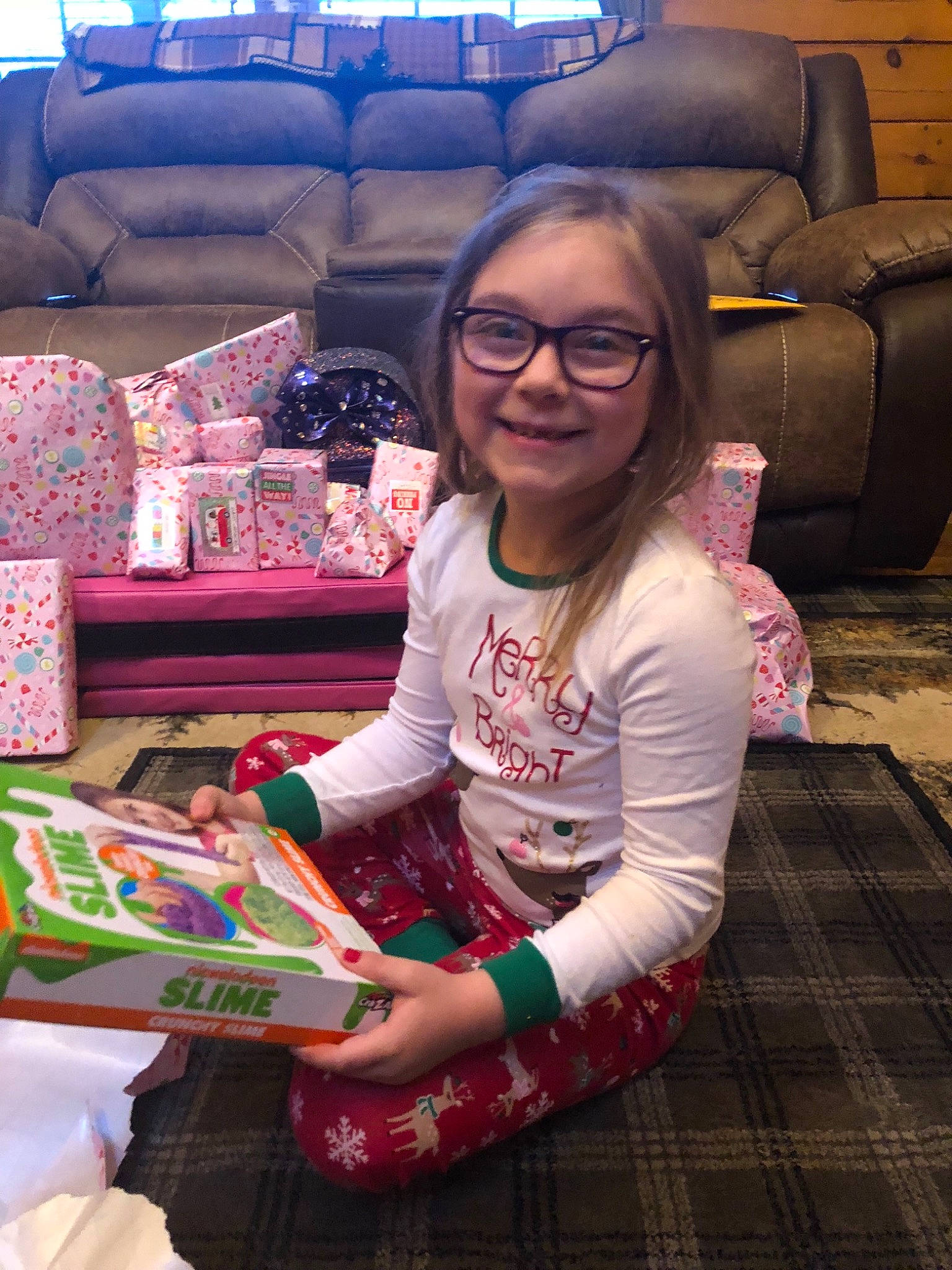 Abrianna is registered to the contest to win money with this photo: child, christmas, fun, glasses, holiday, joy, person, pink, smile, textile, toddler