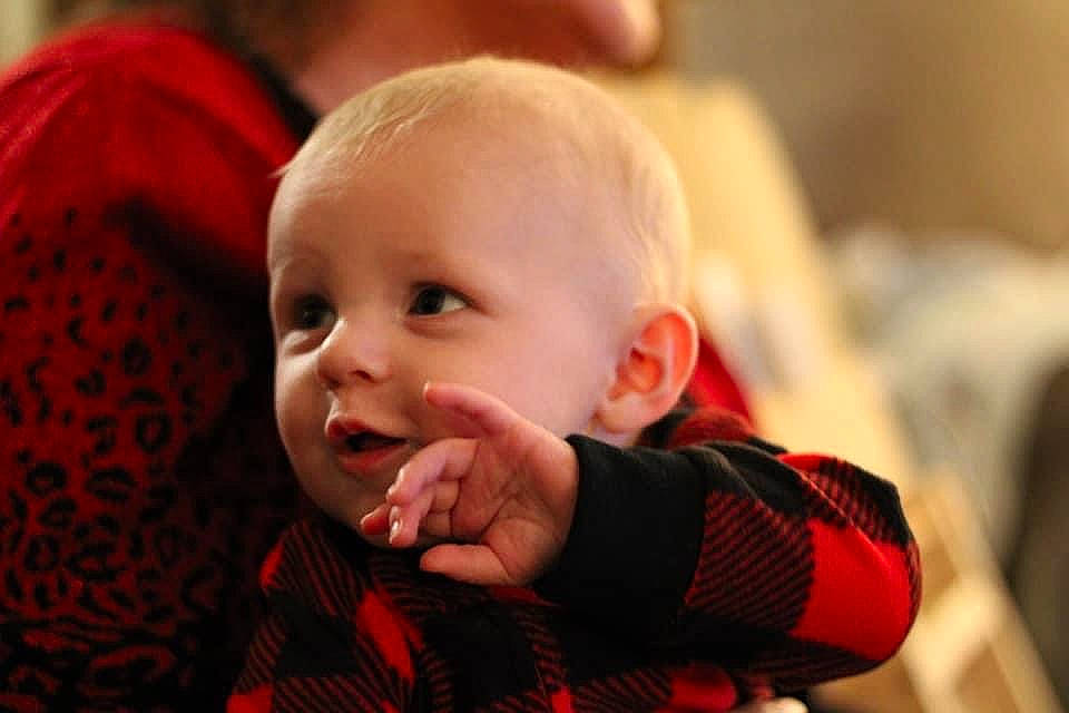 Logan joined the competition — help win amazing prizes! baby, baby_toddler_clothing, cheek, child, comfort, event, finger, fun, happy, human, iris, pattern, person, plaid, room, sitting, skin, sleeve, smile, tartan