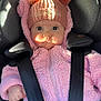 baby, child, car_seat, pink_jacket, knit_hat, pom_poms, wide_eyes, infant, cute, warm_clothing, seatbelt, straps, portrait, indoors, sunlight, face, expression, hand, winter_wear, cozy