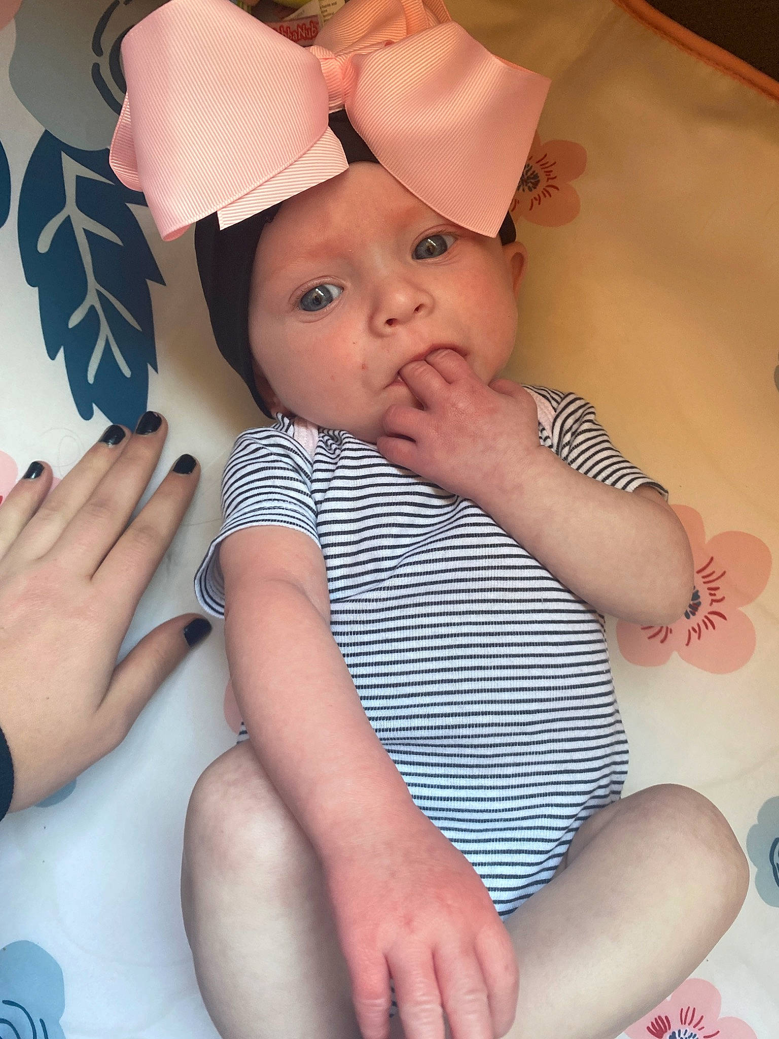 Estelle is registered to the contest to win money with this photo: baby, baby_toddler_clothing, birth, child, finger, hat, headgear, headwear, person, skin, smile, toddler