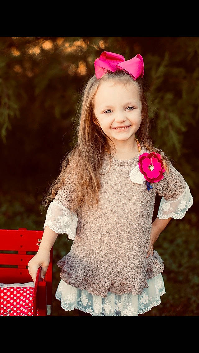 Aubre joined the competition — help win amazing prizes! child, child_model, costume, costume_accessory, embellishment, fashion_accessory, hair_accessory, happy, headband, headpiece, joy, magenta, person, petal, photography, pink, portrait_photography, red, ruffle, smile