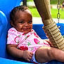 Malaina is registered to the contest to win money with this photo: baby, child, smiling, swing, blue, outdoor, playground, onesie, strawberry, cute, infant, happy, person, seat, park, summer, grass, fun, play, young