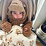 Harrison joined the competition — help win amazing prizes! baby, child, stroller, blanket, bear_pattern, brown_clothing, fuzzy_jacket, hat, pacifier, indoor, floor, wooden_floor, person, cute, warm_clothing, face, eyes, hand, infant, cozy