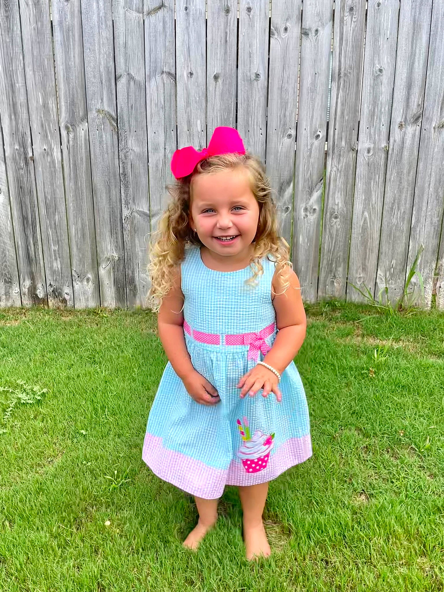 Bailey joined the competition — help win amazing prizes! baby_toddler_clothing, child, day_dress, dress, fence, fun, grass, grassland, happy, headband, headpiece, home_fencing, joy, magenta, one_piece_garment, pattern, people_in_nature, person, pink, recreation