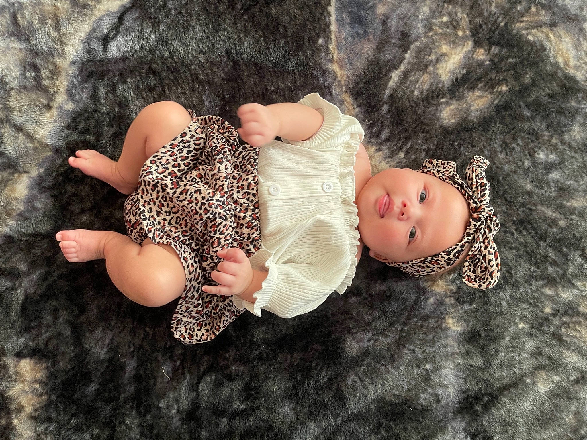 Amberley joined the competition — help win amazing prizes! baby, baby_toddler_clothing, child, fashion_accessory, fawn, foot, grass, head, headgear, headwear, human_body, leg, mammal, pattern, person, sleeve, textile, thigh, toddler, tree