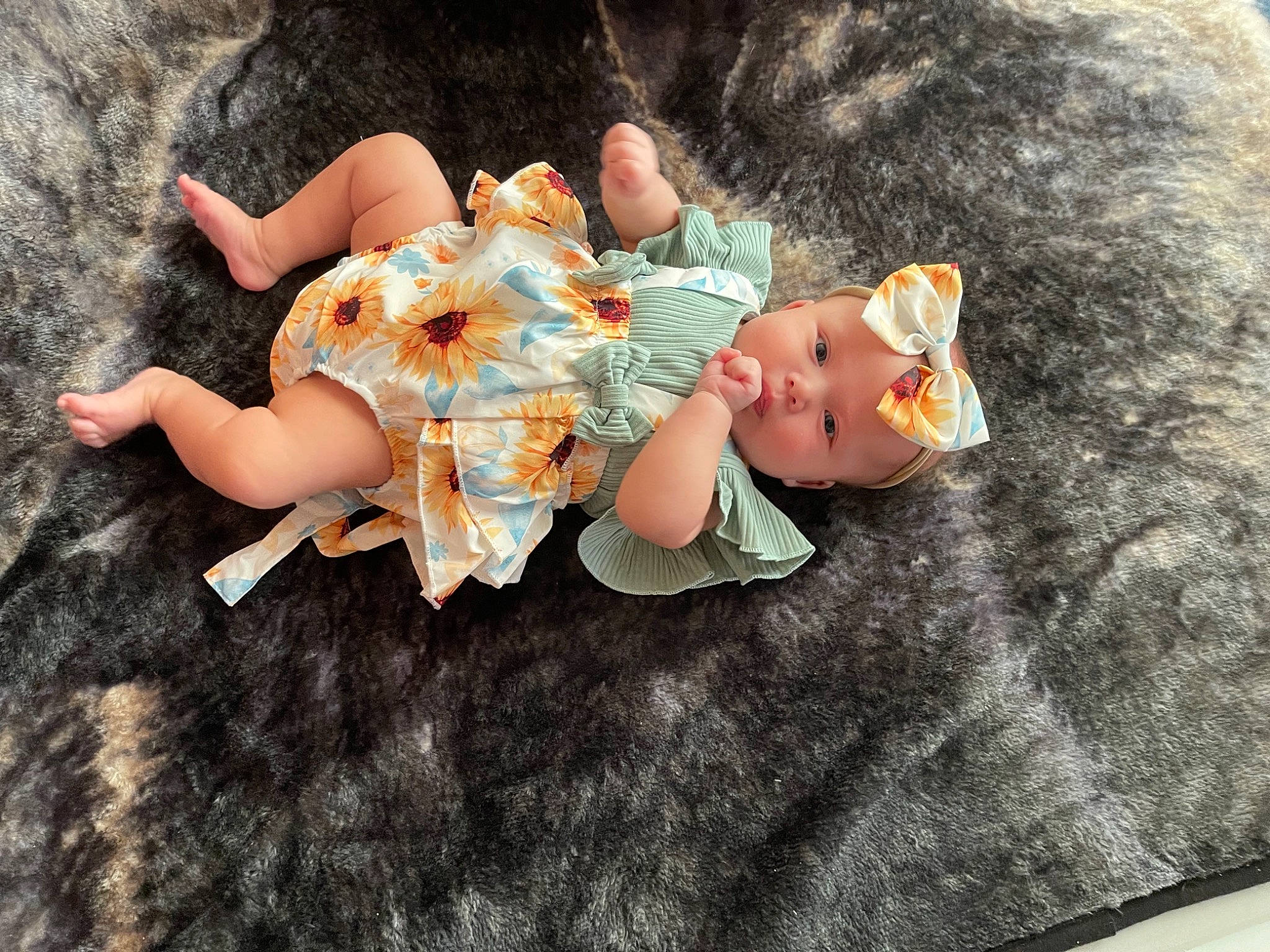 Amberley is registered to the contest to win money with this photo: baby, baby_toddler_clothing, barefoot, child, doll, dress, fawn, foot, grass, happy, hat, headwear, human_leg, lap, person, sitting, sock, stuffed_toy, textile, thigh