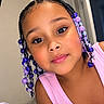 Londyn Rose is registered to the contest to win money with this photo: child, portrait, smiling, indoors, bedroom, braids, hair_beads, purple, pink, tank_top, face, eyes, eyelashes, close_up, sitting, bed, blanket, home, colorful, happy