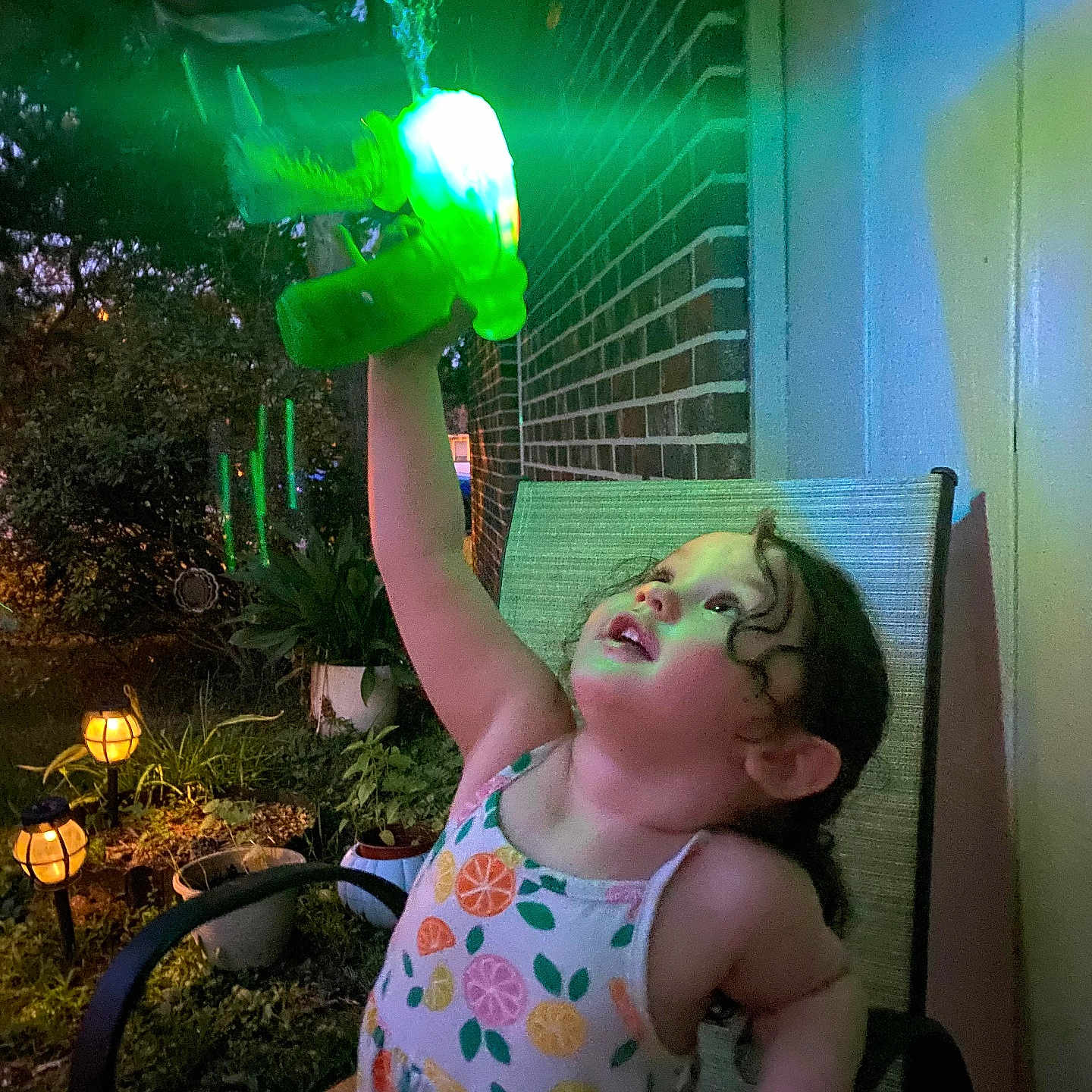 Leah joined the competition — help win amazing prizes! baby, backyard, chair, clothing, dress, face, furniture, head, lamp, light, lighting, nature, outdoors, person, photography, plant, portrait, pottedplant, summer, yard
