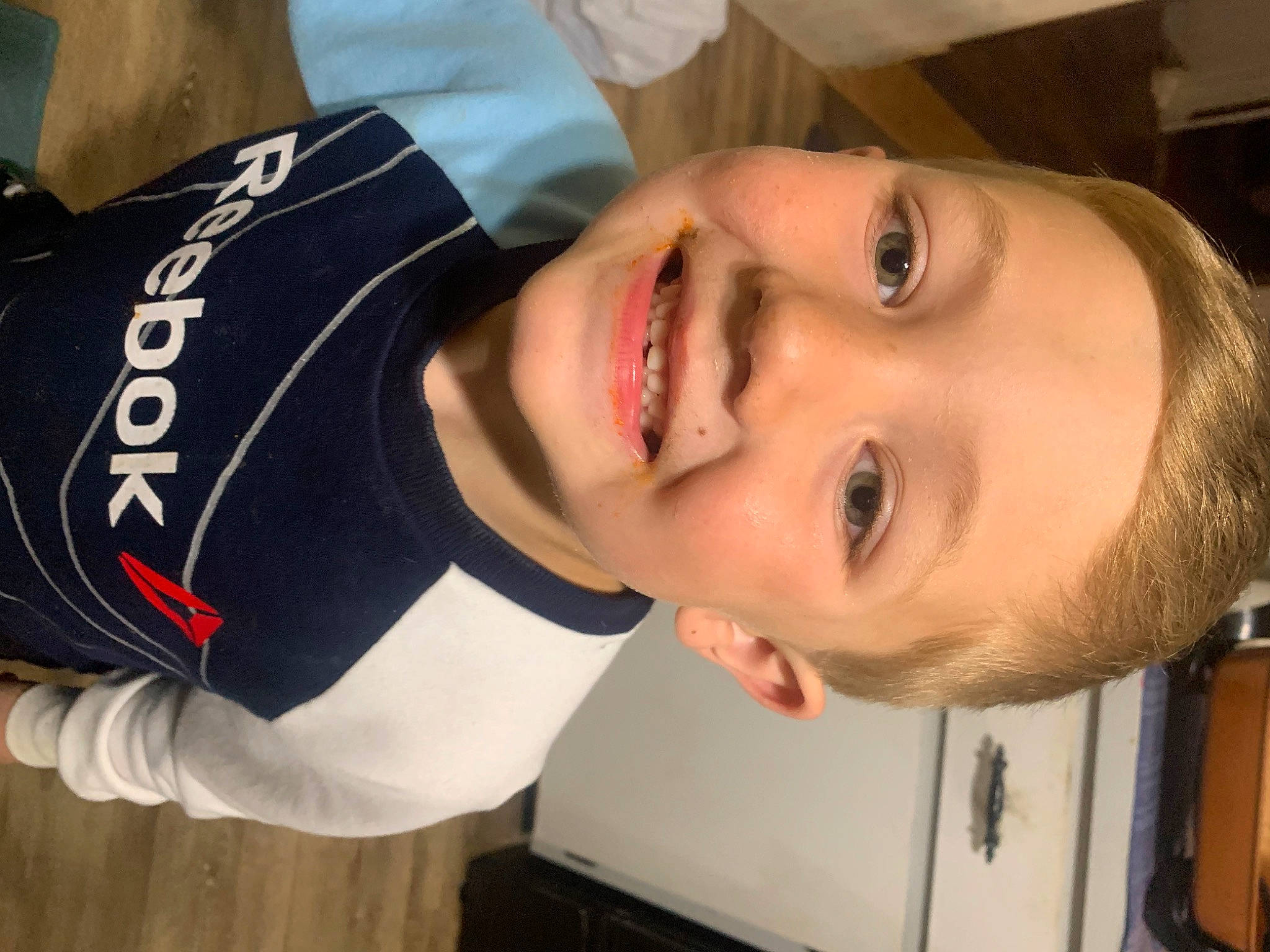 Elias is registered to the contest to win money with this photo: cheek, chin, ear, eye, eyebrow, eyelash, facial_expression, forehead, happy, jaw, joy, lip, mammal, mouth, neck, nose, person, plant, skin, sleeve