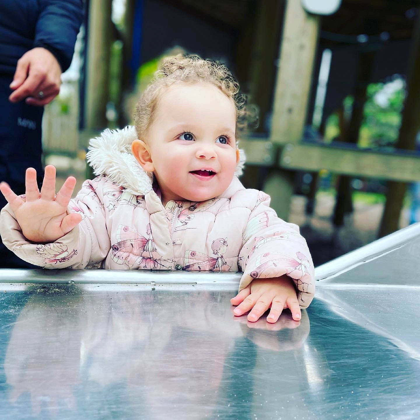 Esmae is registered to the contest to win money with this photo: baby, baby_toddler_clothing, cheek, eye, facial_expression, finger, flash_photography, fun, gesture, grass, hairstyle, hand, happy, iris, leisure, people_in_nature, person, skin, smile, standing