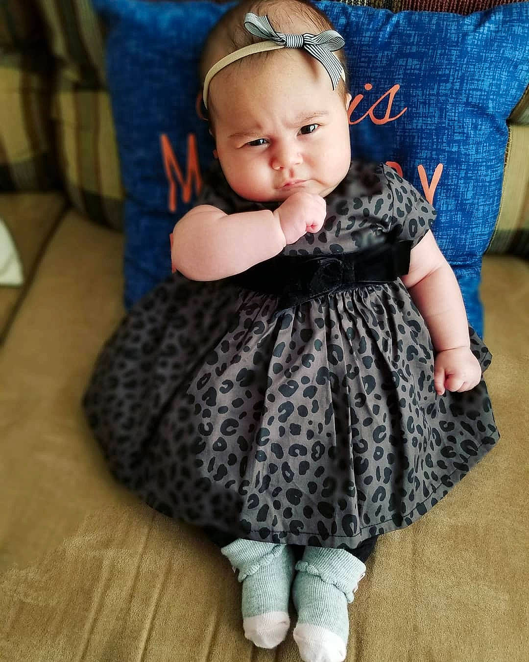 Olivia Jane is registered to the contest to win money with this photo: baby, baby_toddler_clothing, blue, cheek, child, child_model, clothing, design, dress, face, head, iris, pattern, person, shoe, sitting, skin, smile, toddler