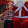 Benjamin a rejoint le concours — aidez-le/la à gagner de superbes lots ! child, santa_claus, smiling_child, christmas_hat, poinsettia, gold_tinsel, santa_costume, white_beard, holiday, festive, bench, indoor, portrait, red_clothing, elf_shirt, sneakers, family_photo, smile, tradition, decorations