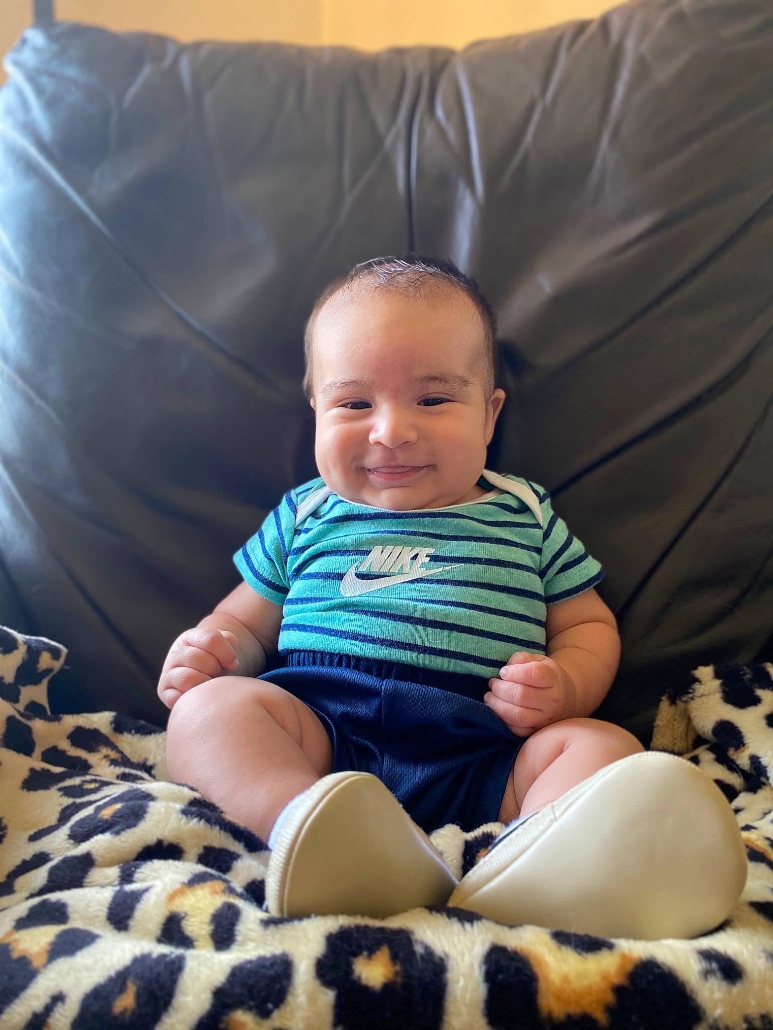 Leonidas joined the competition — help win amazing prizes! baby, baby_toddler_clothing, comfort, couch, finger, flash_photography, happy, human_leg, joy, knee, leg, pattern, person, purple, sitting, skin, sleeve, smile, sock, t_shirt