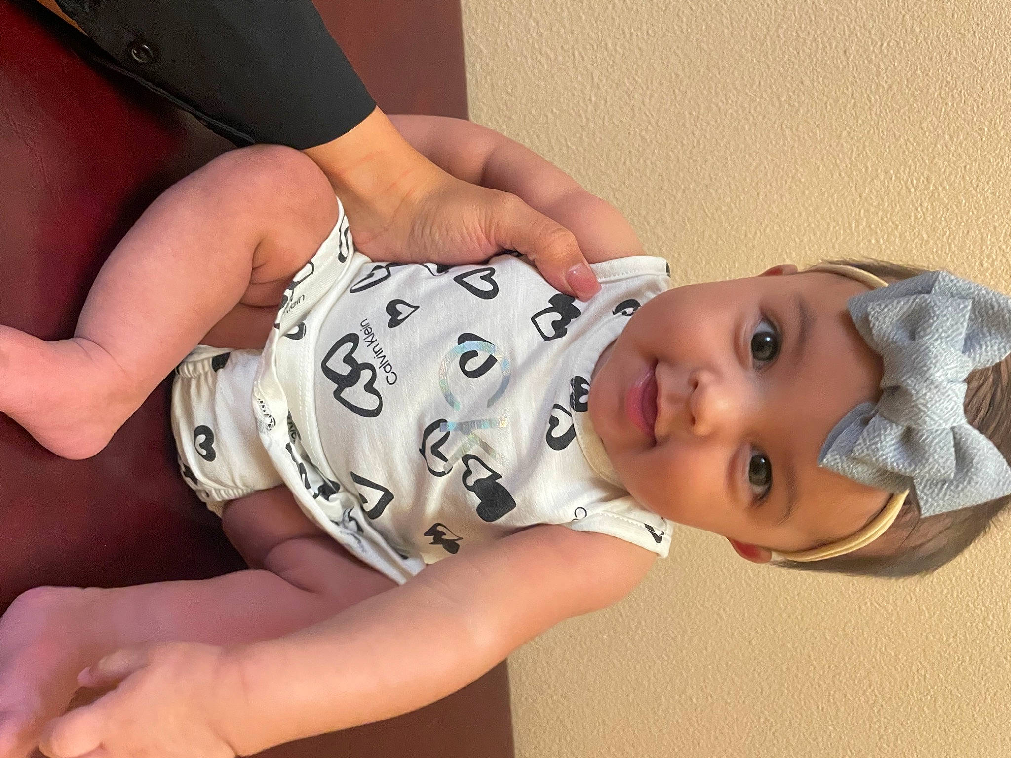 Anaya joined the competition — help win amazing prizes! arm, baby, baby_toddler_clothing, cheek, comfort, elbow, eye, eyelash, finger, gesture, hand, headwear, joint, mouth, neck, organ, person, skin, sleeve, thigh