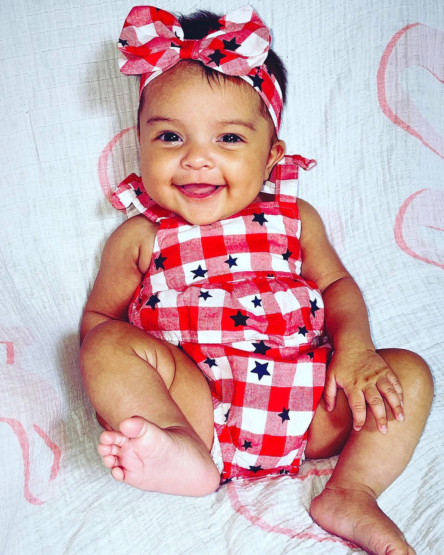 Anaya joined the competition — help win amazing prizes! baby, baby_toddler_clothing, comfort, day_dress, dress, gesture, happy, head, headband, headwear, joy, leg, nail, neck, pattern, person, pink, skin, sleeve, smile