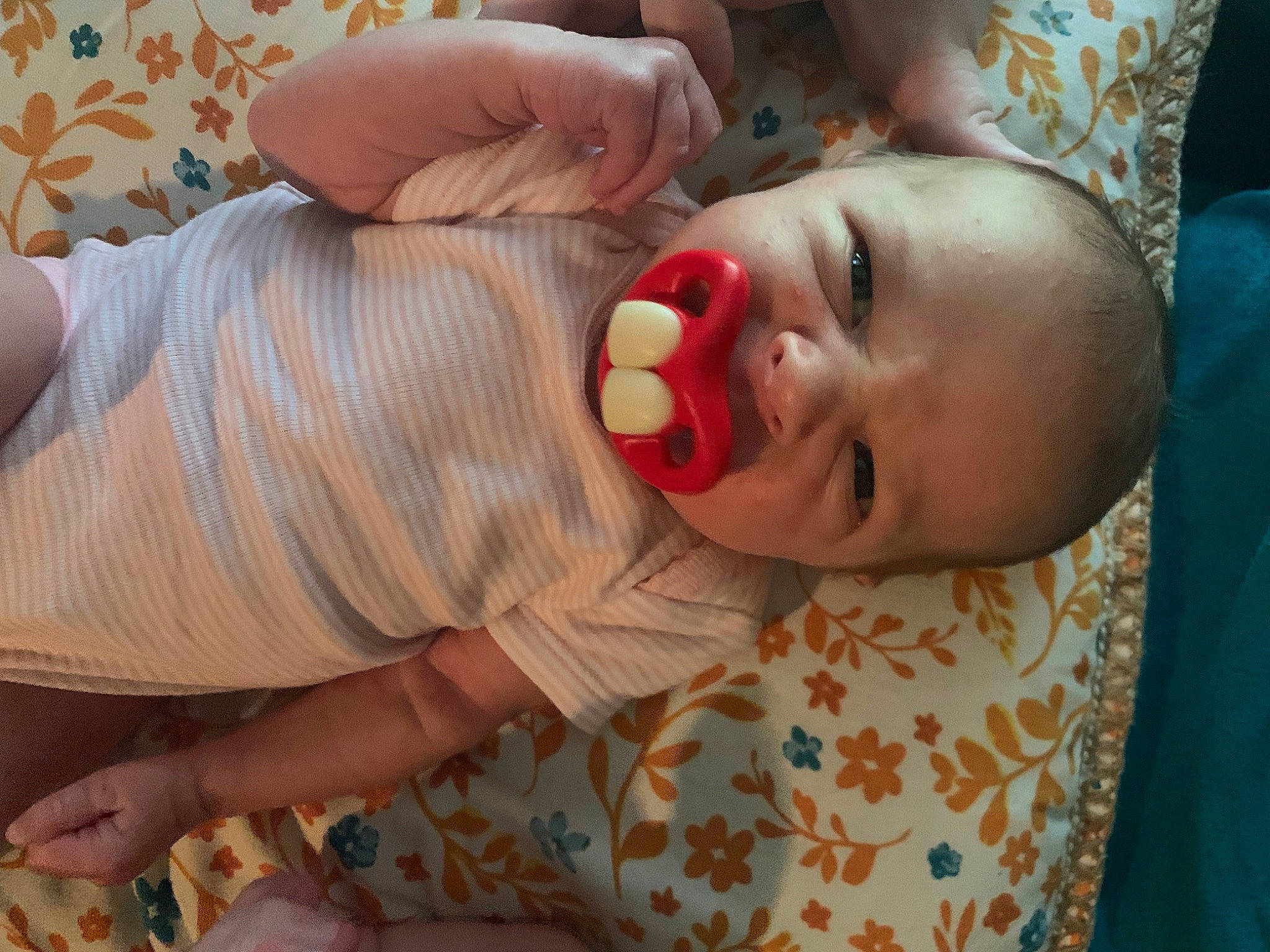 Brinleigh is registered to the contest to win money with this photo: baby, baby_toddler_clothing, cheek, child, comfort, eyelash, finger, fun, gesture, hand, happy, human_body, lip, mouth, nail, nose, person, skin, smile, thumb