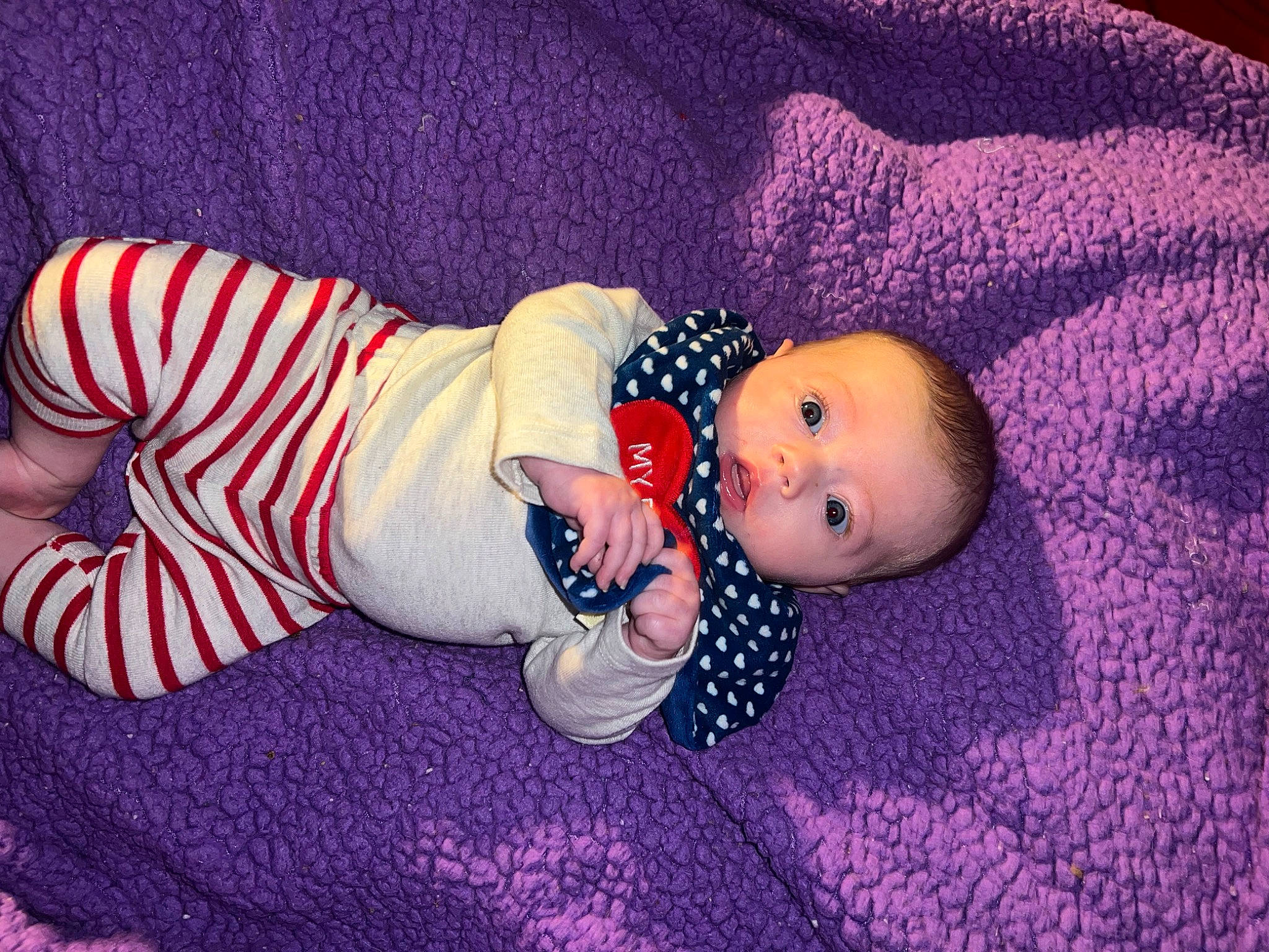 Violet is registered to the contest to win money with this photo: baby, baby_products, baby_sleeping, baby_toddler_clothing, carmine, child, comfort, costume_hat, face, flooring, hat, human_body, linens, magenta, pattern, person, room, sleeve, sunglasses, toddler