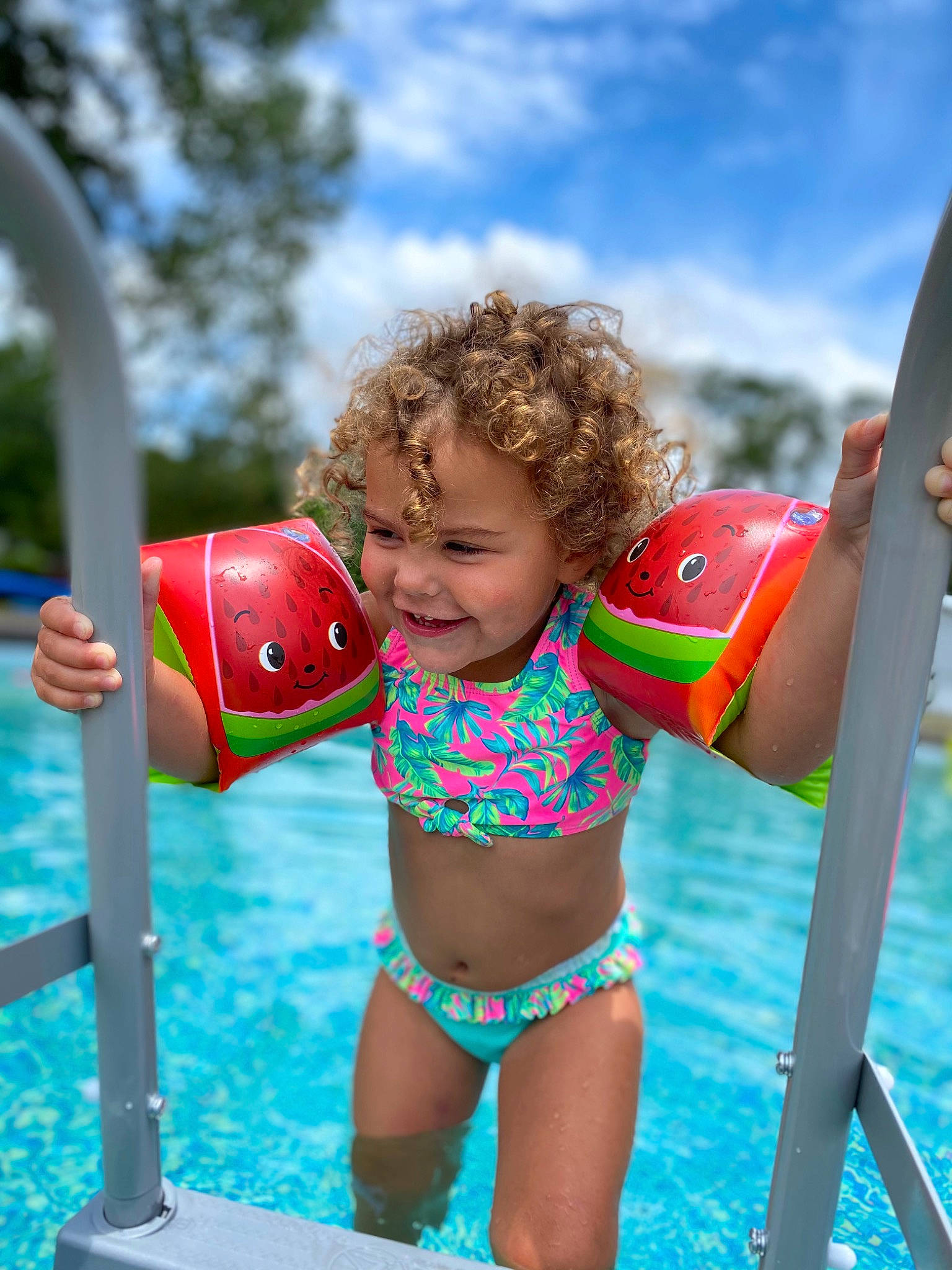 Memri is registered to the contest to win money with this photo: aqua, brassiere, child, cloud, electric_blue, fun, happy, joy, leisure, one_piece_swimsuit, people_in_nature, person, play, recreation, sky, smile, swimwear, thigh, toddler, undergarment