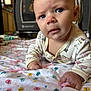 Madilynn is registered to the contest to win money with this photo: baby, infant, blanket, butterflies, curious, face, hands, playpen, indoor, crawling, onesie, clothing, floor, home, expression, child, person, cute, young, portrait