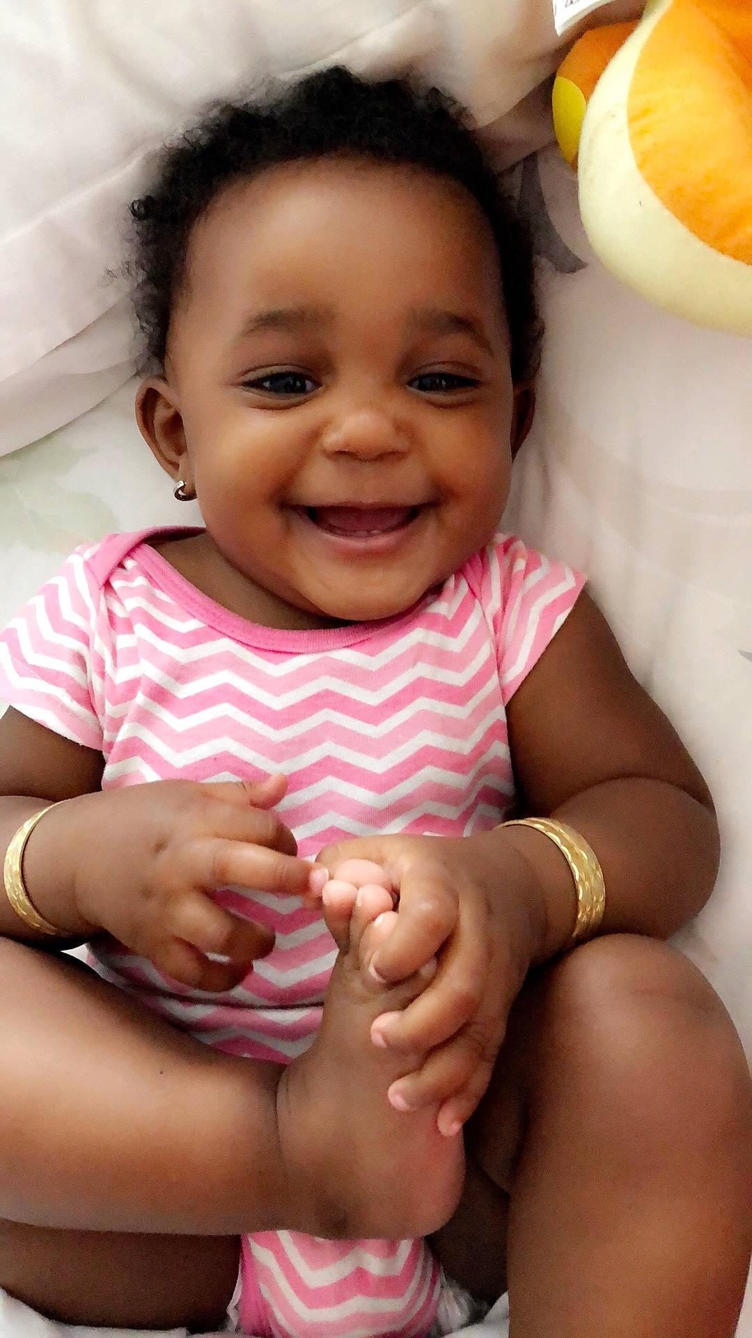 Cadence is registered to the contest to win money with this photo: abdomen, black_hair, cheek, child, finger, fun, girl, hand, happiness, infant, joy, leg, lip, person, skin, smile, toddler