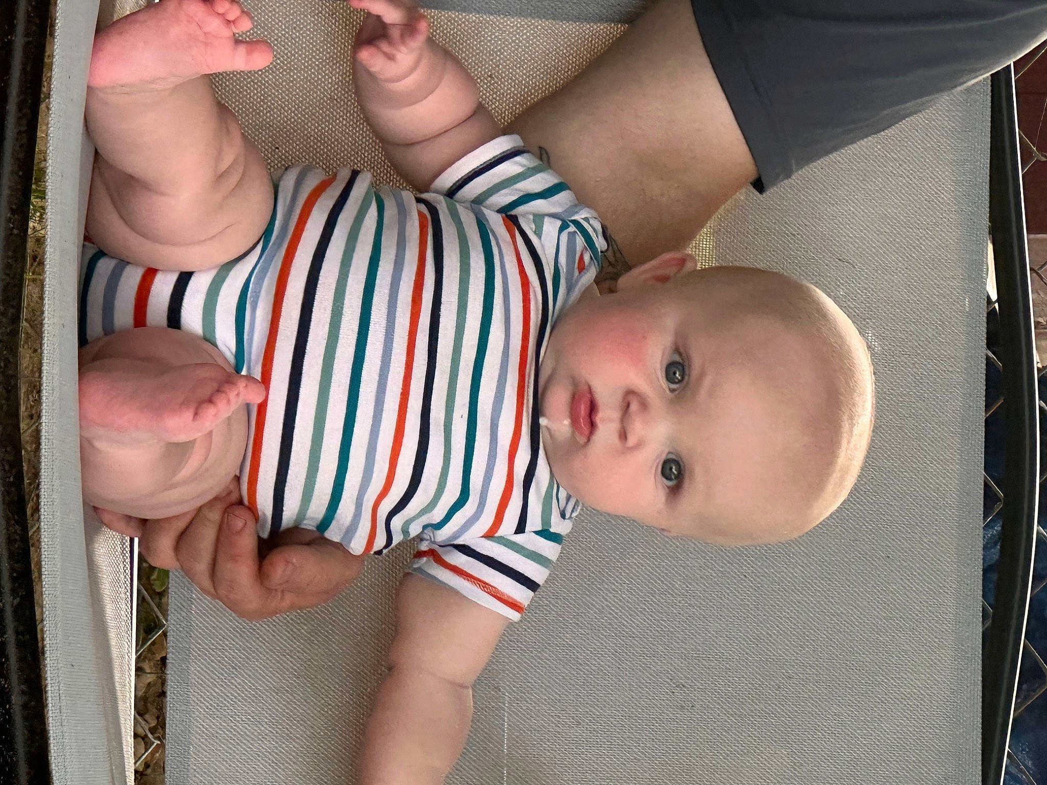 Henley is registered to the contest to win money with this photo: baby, baby_toddler_clothing, cheek, child, comfort, eye, facial_expression, finger, gesture, hand, mammal, mouth, nail, organ, pattern, person, product, skin, textile, thumb