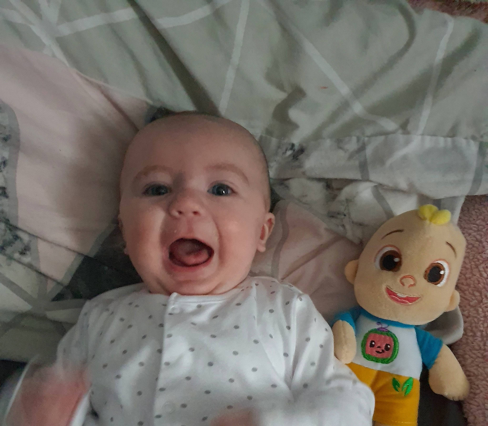 Kieran is registered to the contest to win money with this photo: baby, baby_products, baby_toddler_clothing, cheek, child, comfort, doll, eyelash, happy, head, iris, nose, person, pink, skin, smile, stuffed_toy, textile, toddler, toy