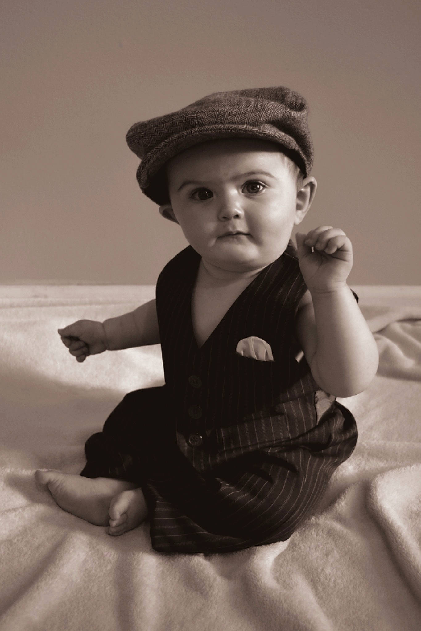 Cameron is registered to the contest to win money with this photo: baby_toddler_clothing, black_and_white, cap, child, comfort, eye, face, facial_expression, finger, flash_photography, gesture, hairstyle, happy, hat, head, headwear, lip, person, skin, sleeve