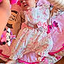 baby, bows, cherry, child, colorful, curious, cute, dress, floor, foot, hand, indoor, infant, minnie_mouse, pattern, person, pink, play_mat, smile, toy