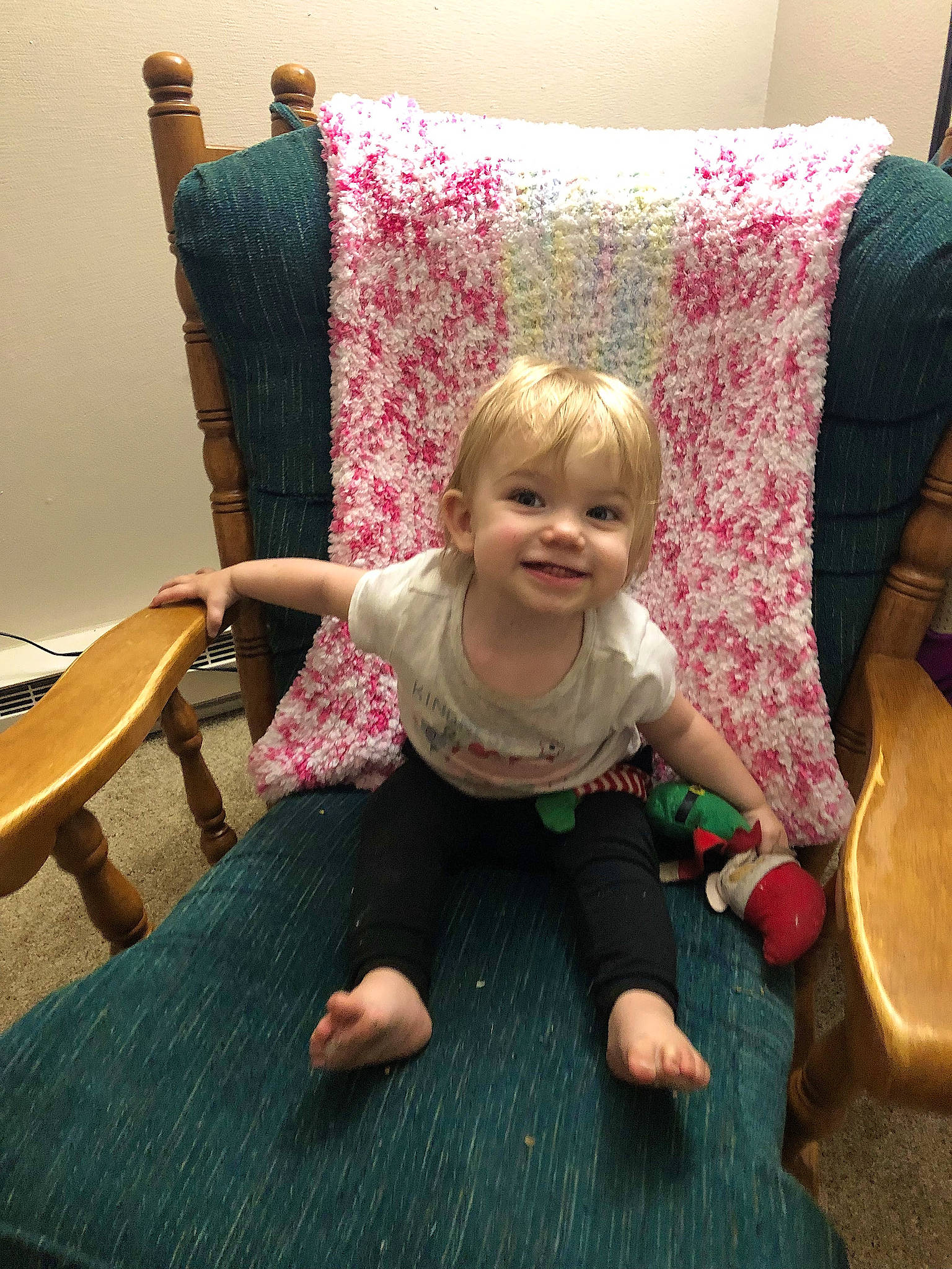 Abigail is registered to the contest to win money with this photo: baby_toddler_clothing, chair, child, comfort, floor, flooring, foot, fun, furniture, hairstyle, happy, hardwood, joy, person, pillow, purple, room, sitting, smile, textile