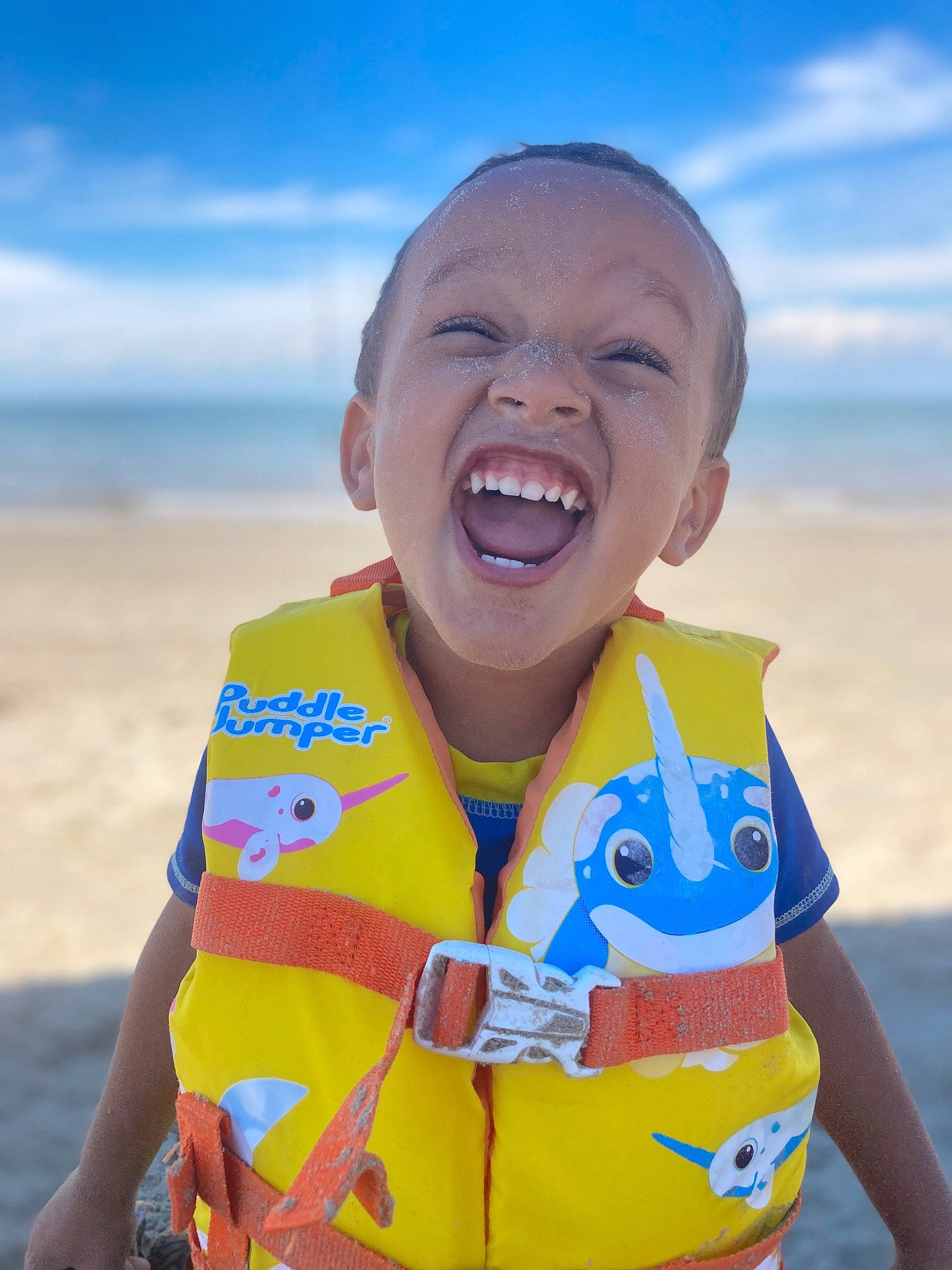 Jonah joined the competition — help win amazing prizes! blue, cloud, electric_blue, fun, gesture, happy, landscape, leisure, people_in_nature, people_on_beach, person, personal_protective_equipment, recreation, sand, sky, sleeve, smile, summer, t_shirt, toddler