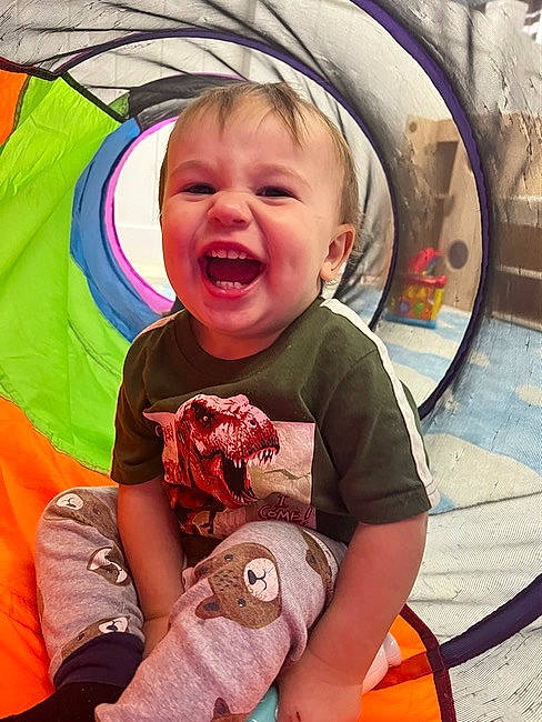 Benjamin is registered to the contest to win money with this photo: baby, baby_toddler_clothing, child, cool, eye, face, fun, happy, head, human_body, leisure, mouth, organ, person, pink, recreation, sleeve, smile, sneakers, t_shirt