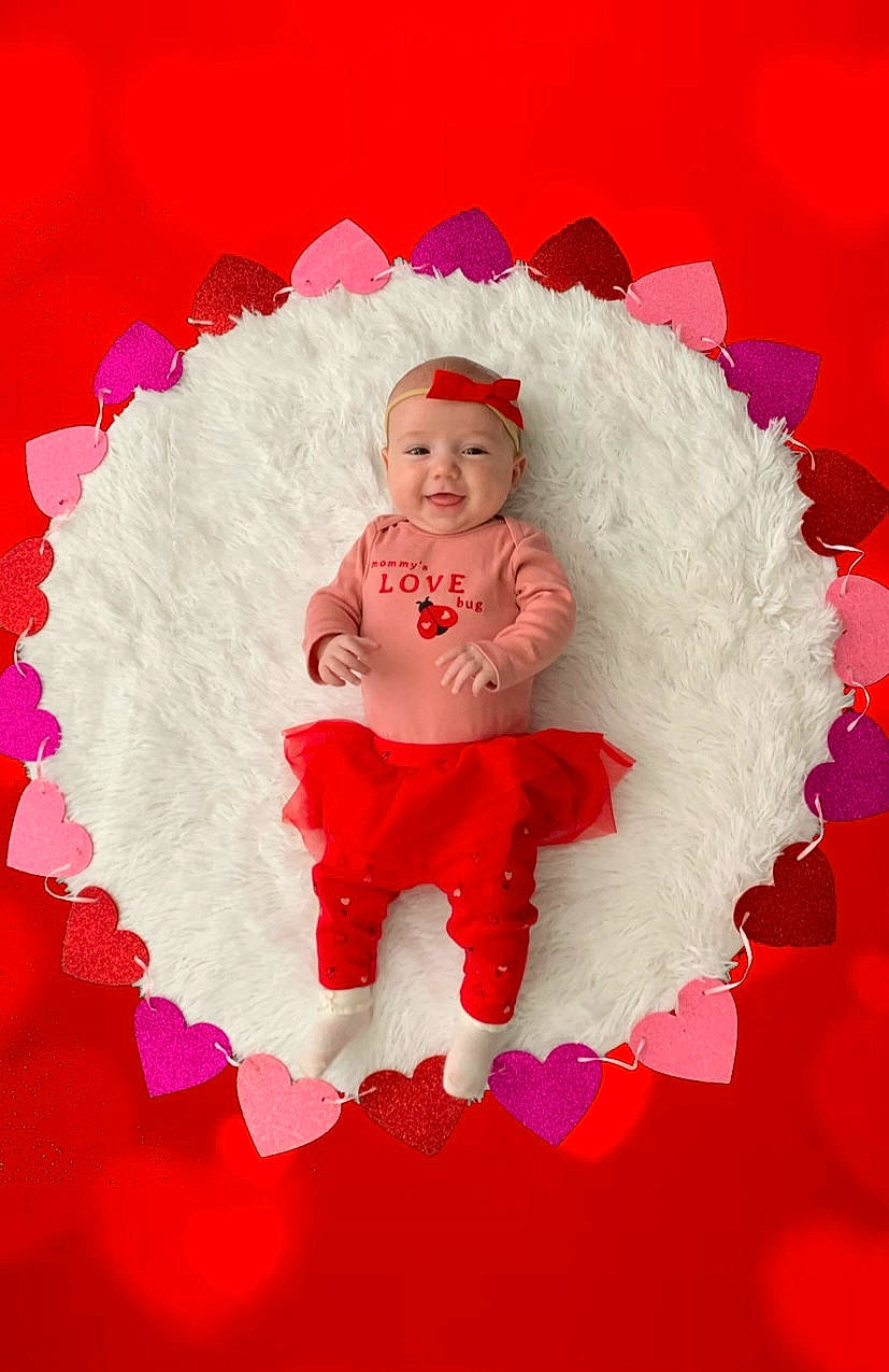 Madelyn joined the competition — help win amazing prizes! art, baby, baby_toddler_clothing, carmine, circle, costume_hat, event, fictional_character, fun, happy, hat, headwear, holiday, human_body, magenta, people_in_nature, person, petal, pink, smile