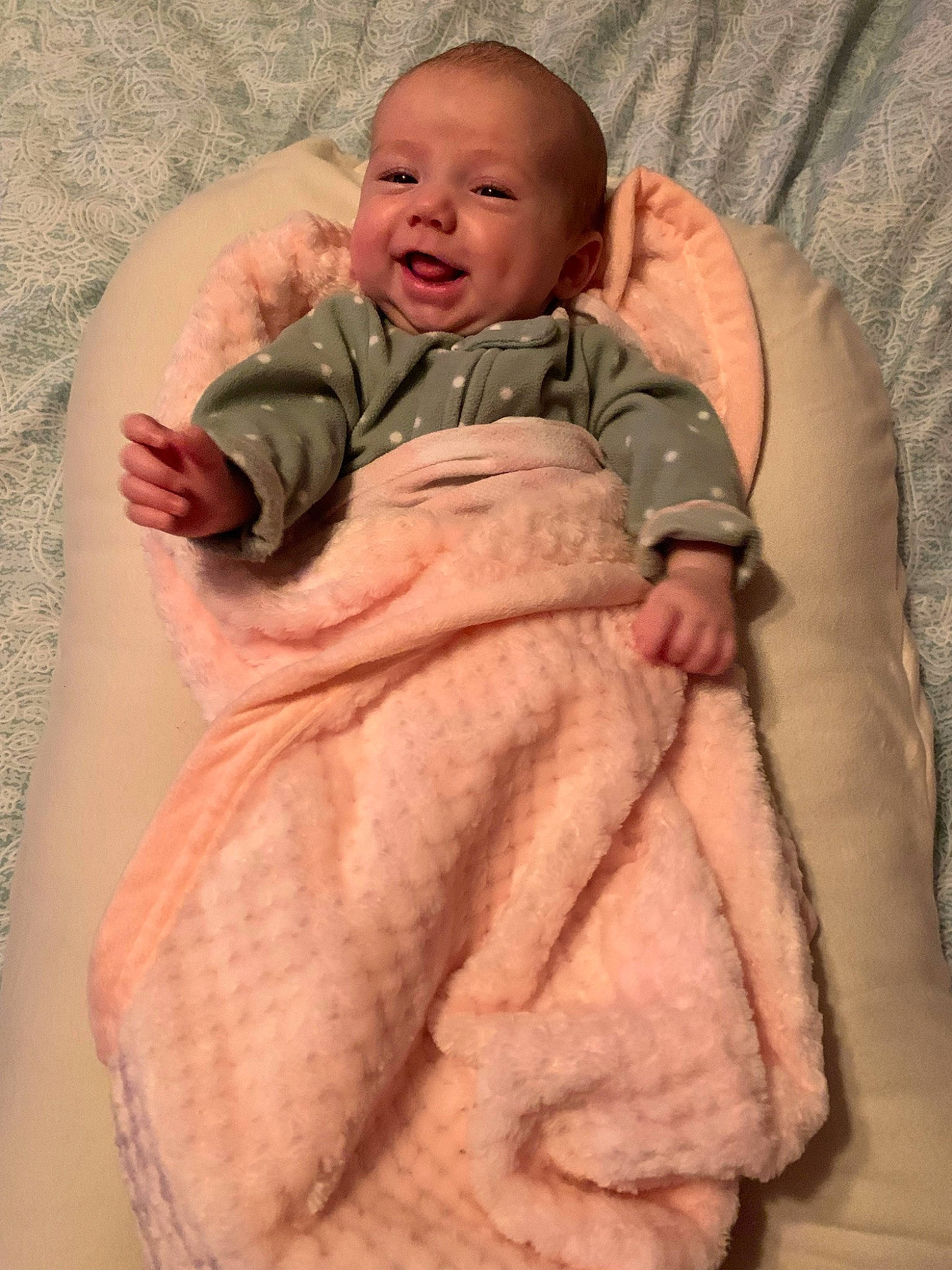 Madelyn is registered to the contest to win money with this photo: baby, baby_products, baby_toddler_clothing, cheek, child, chin, comfort, eye, face, finger, happy, head, linens, person, pink, sitting, skin, sleeve, smile, thumb