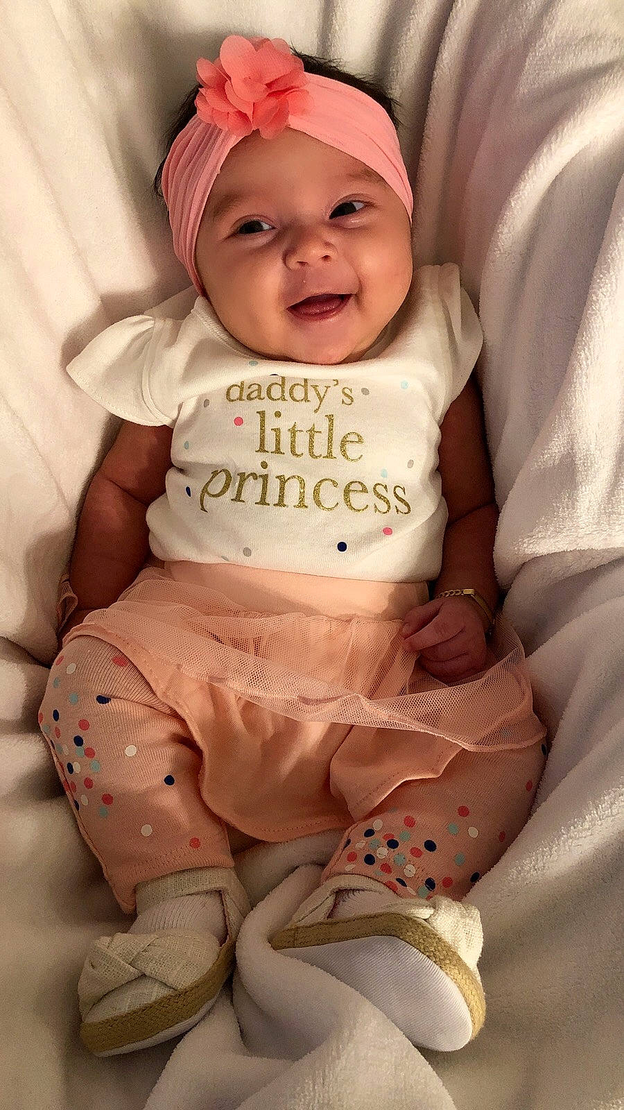 Katherine is registered to the contest to win money with this photo: baby_products, bedtime, cheek, child, girl, hair_accessory, happiness, headgear, infant, person, pink, product, sitting, skin, smile, textile, toddler