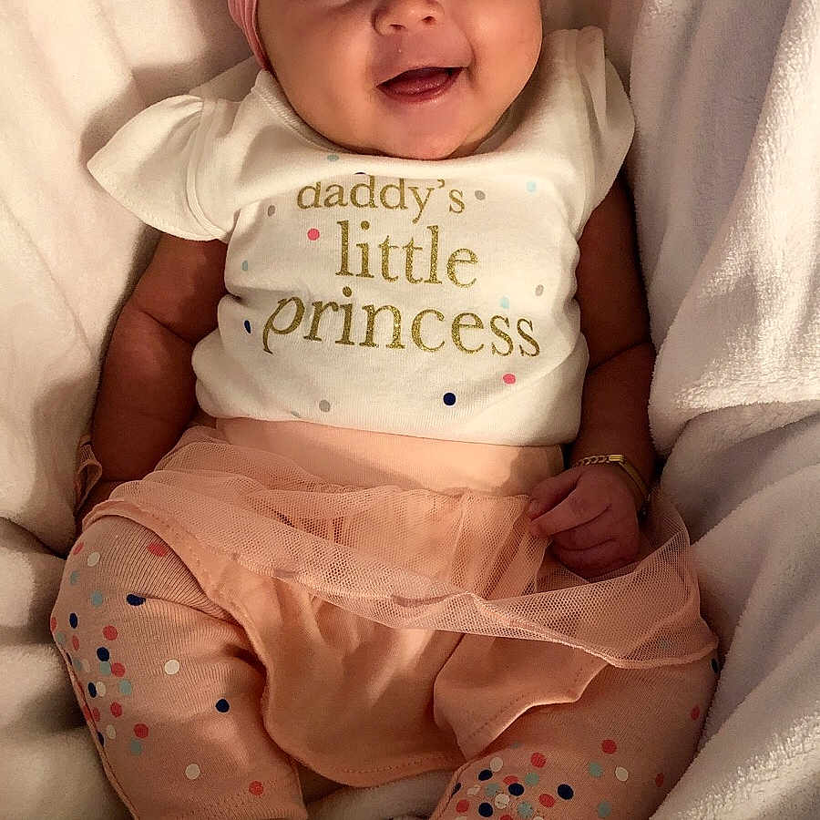 Katherine is registered to the contest to win money with this photo: baby_products, bedtime, cheek, child, girl, hair_accessory, happiness, headgear, infant, person, pink, product, sitting, skin, smile, textile, toddler